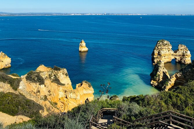 Algarve: Lagos Sightseeing guided Tour with e-bikes - Riding through Lagos and past the old defenses