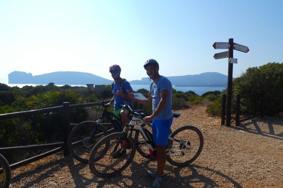Alghero: Small Beaches E-Bike Tour with Aperitivo - Riding through Porto Conte Regional Park