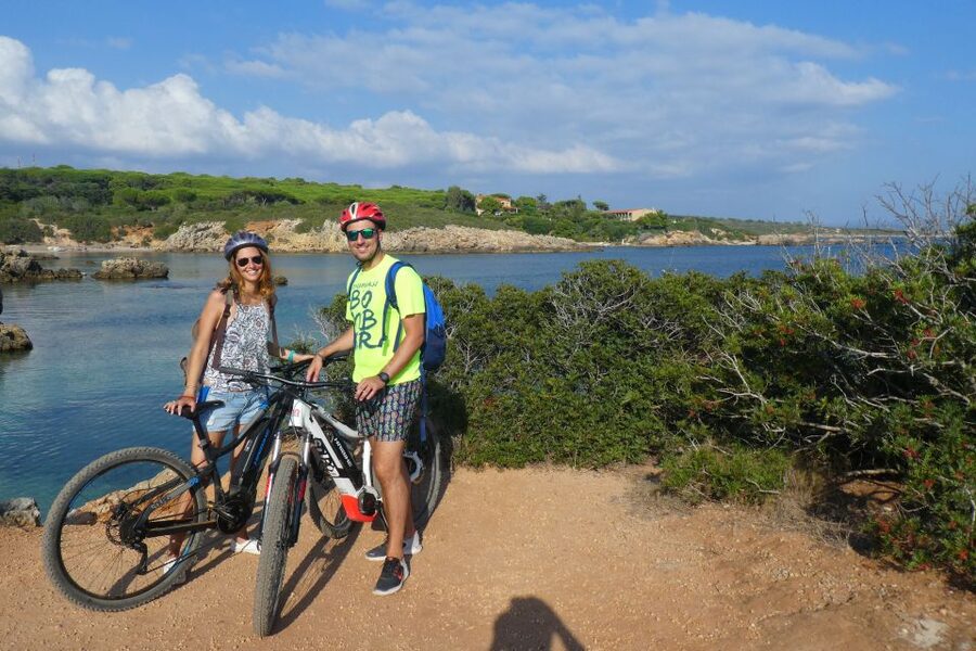 Alghero: Small Beaches E-Bike Tour with Aperitivo - A guide-led ride that adjusts to your group