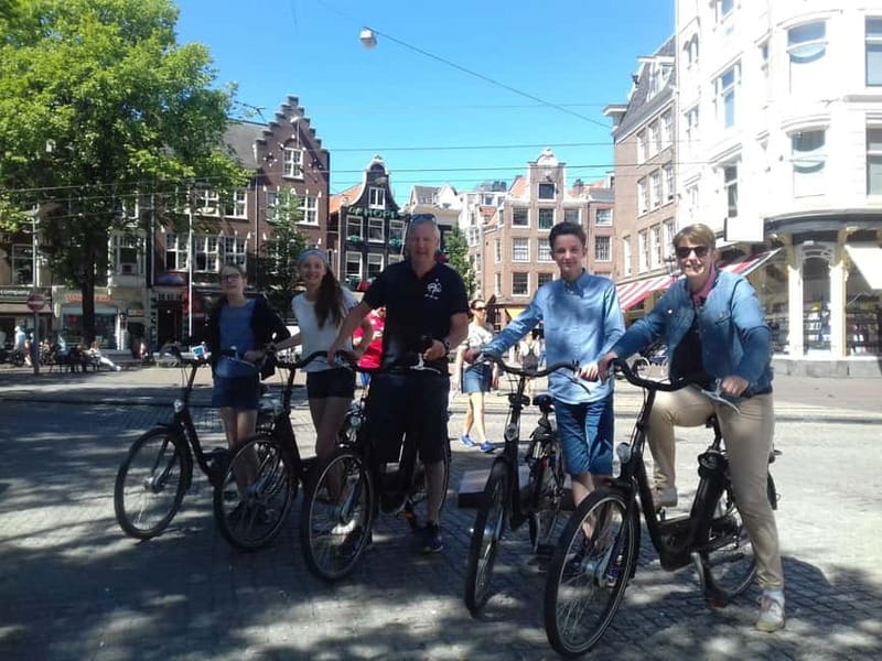 Amsterdam bike tour with a French-speaking guide local! - Dam Square and the old city center