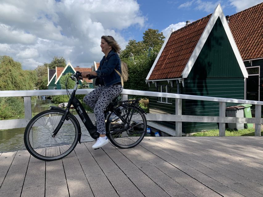 Amsterdam: Countryside Bike Tour and Zaanse Schans Windmills - What the guide adds to the day