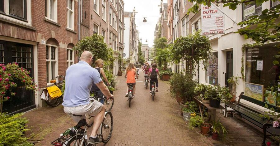 Amsterdam: Hidden Gems & Highlights Guided Bike Tour - Why a bike is the right way to meet Amsterdam