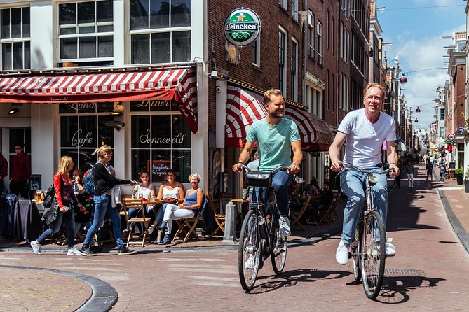 Amsterdam PRIVATE Bike Tour With Locals: Bike & Local Snack Included - Westerkerk and the old canal belt