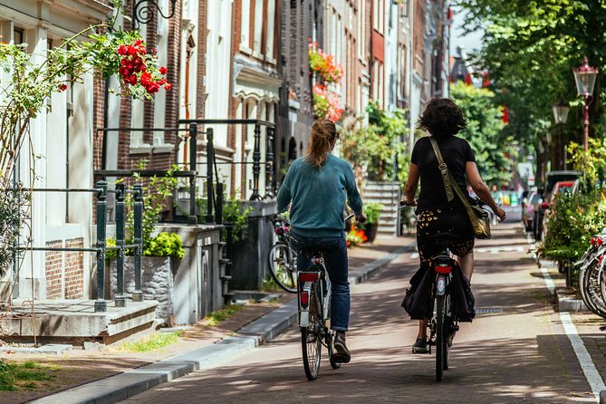 Amsterdam PRIVATE Bike Tour With Locals: Bike & Local Snack Included - Jordaan lanes, canals, and local stops