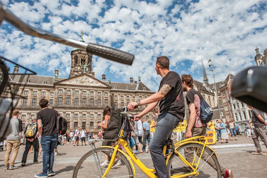 Amsterdam: Relaxed City Highlights Guided Bike Tour - Leidseplein, music, and the city’s rougher side