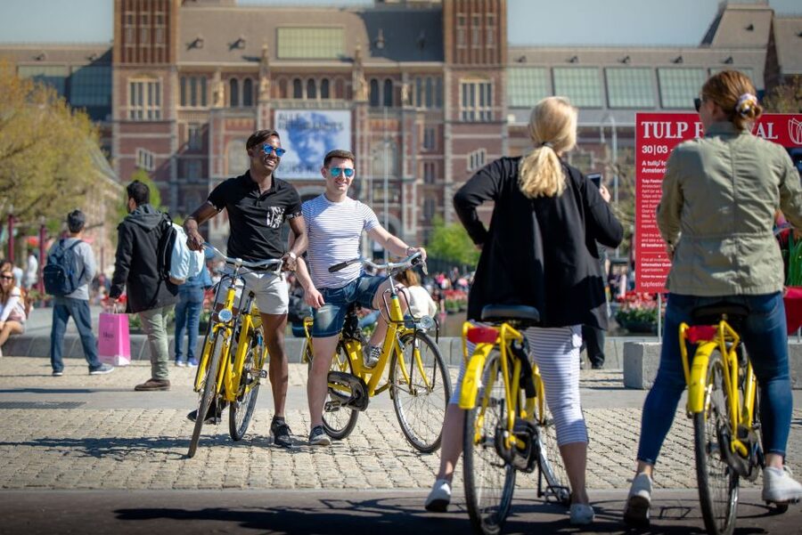 Amsterdam: Relaxed City Highlights Guided Bike Tour - The canal belt and Amsterdam’s smallest house