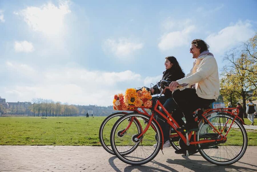 Amsterdam: Top Highlights Guided Bike Tour - The guides and the feel of the ride