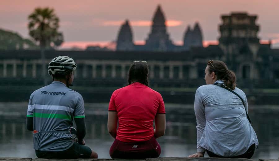 Angkor Wat: Guided Sunrise Bike Tour w/ Breakfast and Lunch - Sunrise at Angkor Wat, the essential first stop
