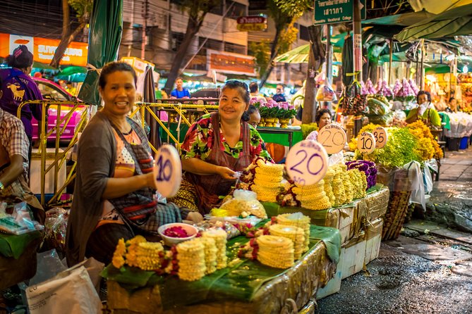 Bangkok: Night Bike Tour with Temples & Flower Market Visit - Crossing the Chao Phraya by local ferry