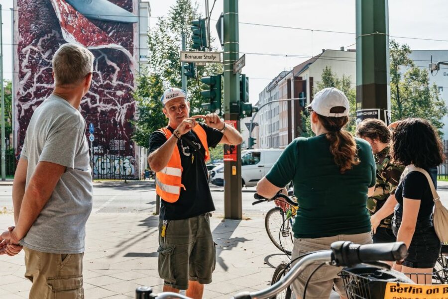 Berlin: Cold War & Berlin Wall History Guided Bike Tour - Checkpoint Charlie and the symbols of the Cold War