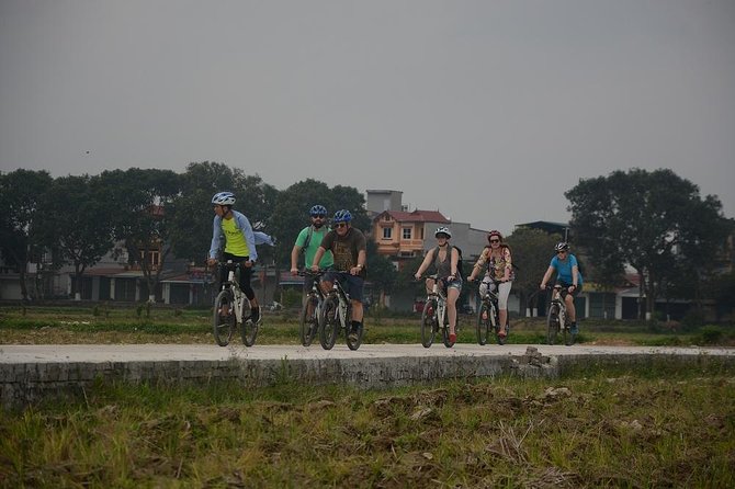 Bicycle Tours Hanoi: Full Day Bicycle Tours City & Countryside - Co Loa, wet-market fruit, and lotus-lake refreshment