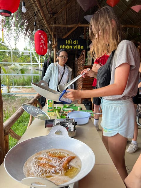 Biking and cooking class in the rural tour at Can Tho - Lunch, fruit, and lotus tea in the garden