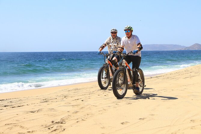 Electric Bike and Beach Camel Ride with Mexican Buffet Lunch - Riding Baja terrain toward the beach
