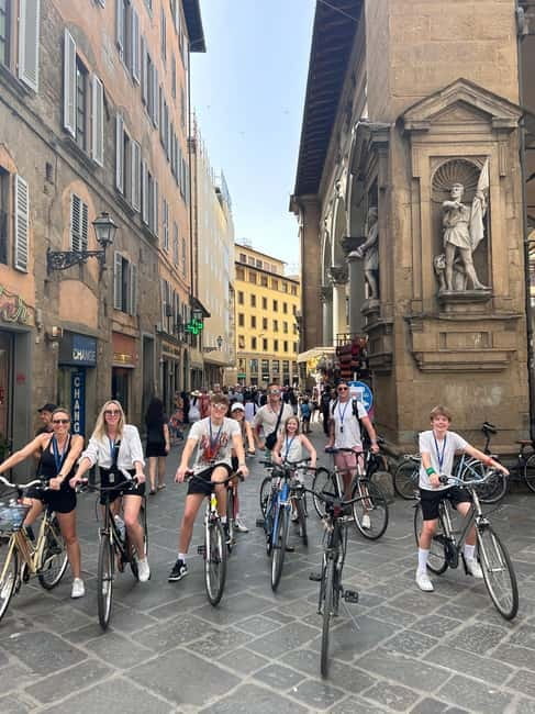 Florence: Untold Small Group Bike Tour - Piazza della Signoria, wine windows, and public drama