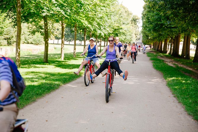 From Paris: Versailles Bike Tour w/ Palace, Gardens, & Picnic - Riding to the Grand Canal