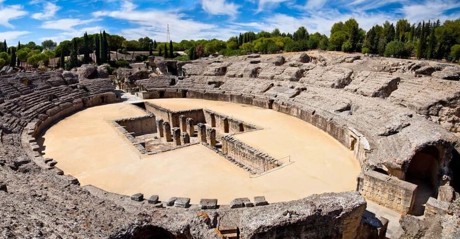 From Seville: Half-Day Guided Bike Trip to Italica - Santiponce adds a local pause
