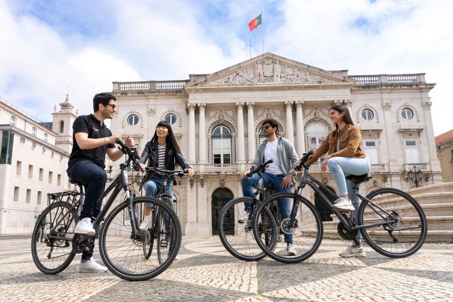 Lisbon: Guided Bike Tour, Helicopter Flight, and Boat Trip - Returning by boat along the Tagus
