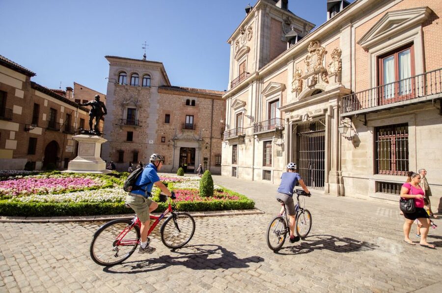 Madrid City Guided Bike/E-Bike Tour for Small Groups - Malasaña brings the ride back to Plaza de España