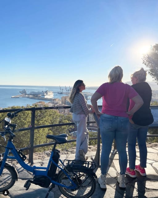 Malaga: Castle Hill and Fisherman Village E-Bike Tour - What the guide adds to the ride