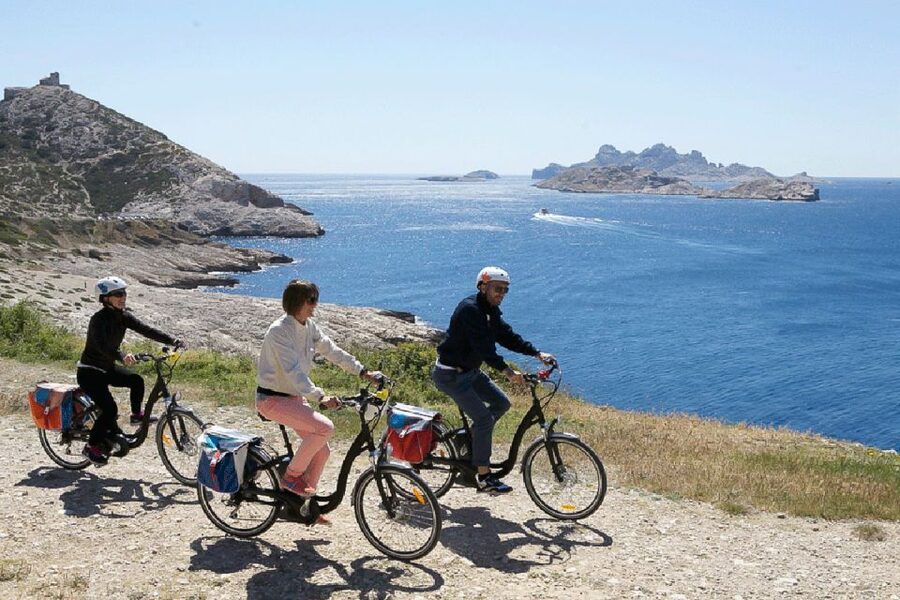 Marseille: Full-Day Guided E-Bike Coast & Calanques Tour - Goudes and Maronaise show a rougher side of Marseille
