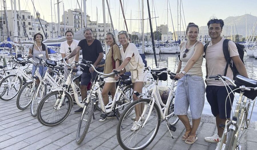 Palermo: Guided Bike Tour with Street Food Tasting - Crossing the Cassaro toward San Francesco Church