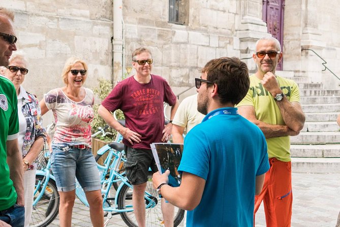 Paris Bike Tour Hidden Secrets in the Latin Quarter & Le Marais neighborhoods - Place des Vosges shows Paris at its most polished