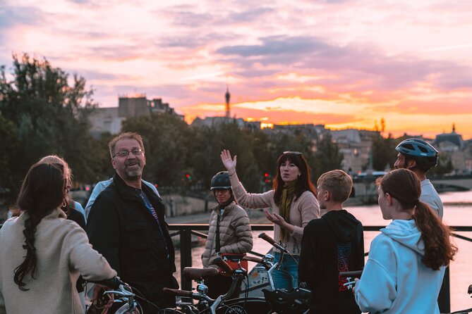 Paris Evening City of Lights Small Group Bike Tour & Boat Cruise - Crossing busy Paris streets by bicycle