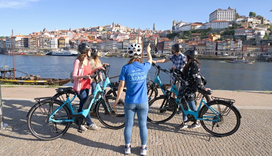 Porto: Riverside Panoramic E-Bike Tour - Roads, cobblestones, and group comfort