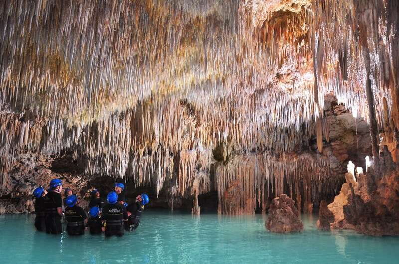 Rio Secreto Nature Reserve: Bicycle, Rappel & Ziplines Tour - Walking beside the underground river
