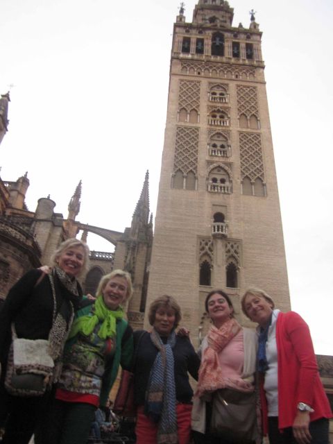 Seville: Highlights City Bike Tour - Crossing into Triana for tiles and flamenco