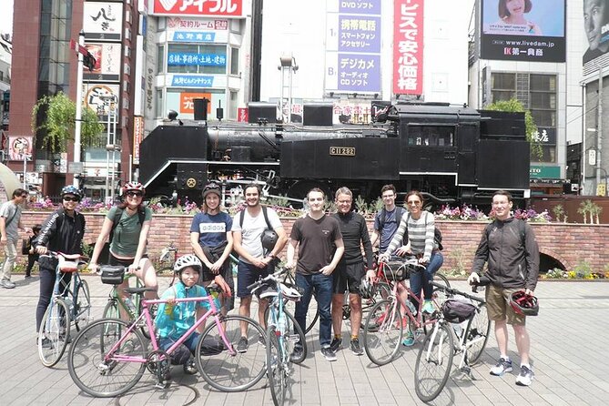 Tokyo Great Cycling Tour - Zojo-ji Temple and the Tokyo Tower contrast